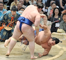 Rehabilitated sumo wrestler repays stablemaster with 1st